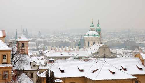 Lesser town and old town of prague in winter with snow.