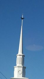 Low angle view of building against clear blue sky