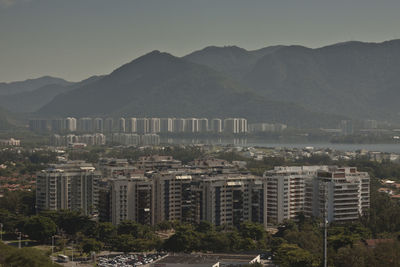 High angle view of buildings in city against sky