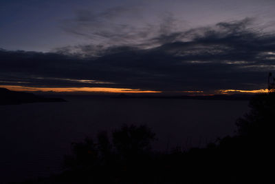 Scenic view of landscape against sky at dusk
