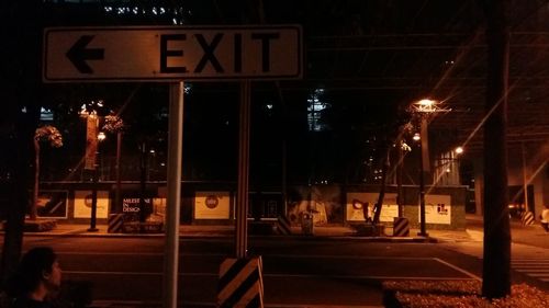 Illuminated lamp in city at night