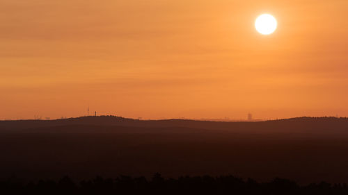 Scenic view of silhouette landscape against romantic sky at sunset