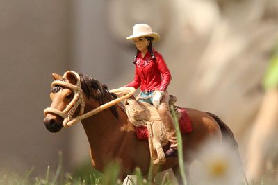 Midsection of man riding hat