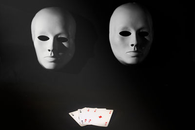 Close-up of lighting equipment on table against black background