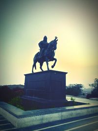 Low angle view of statue against sky