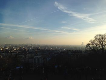 Aerial view of townscape against sky at sunset