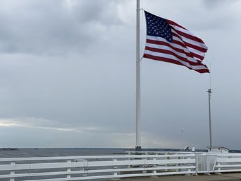 Low angle view of flag against sky