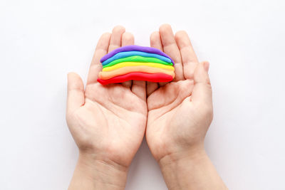 The child sculpts makes a rainbow from plasticine. children's creativity.