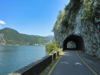 Road by sea against sky