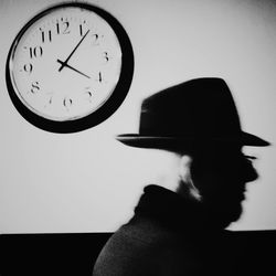 Close-up of clock over white background