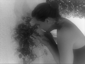 Side view of young woman in bathroom