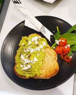 High angle view of breakfast in plate on table