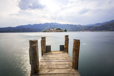 Pier over sea against sky