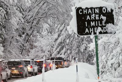 Information sign on snowcapped mountains during winter