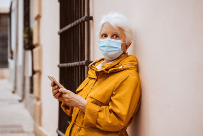 Portrait of young woman using mobile phone