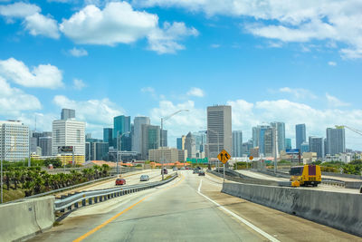 Road in city against sky