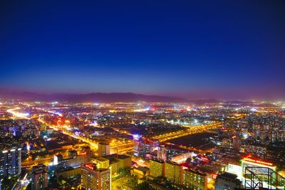 Aerial view of illuminated cityscape