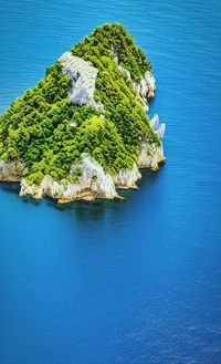 High angle view of sea against blue sky