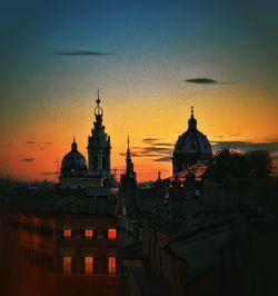 Cathedral against sky during sunset in city