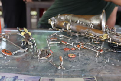 Person working on metal table in factory