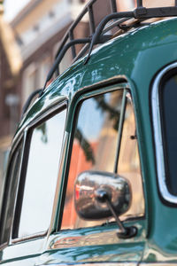 Reflection of man on car window