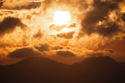Low angle view of dramatic sky during sunset
