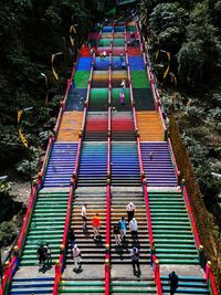 High angle view of people walking on road