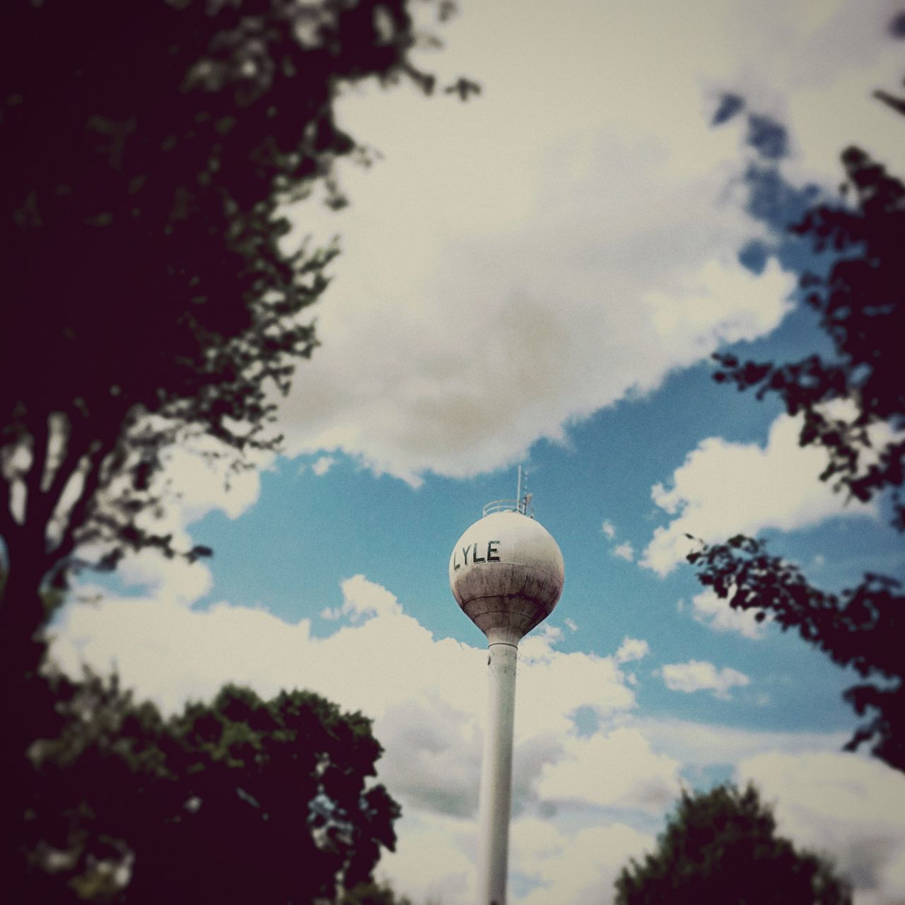 communication, sky, tree, low angle view, outdoors, day, no people, nature, global communications, architecture, technology, beauty in nature