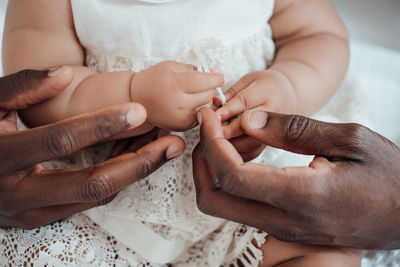 Midsection of woman holding hands