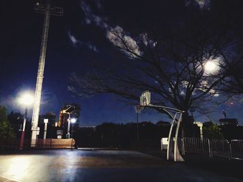 Illuminated city against sky at night