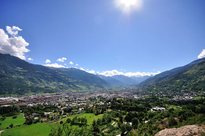 Scenic view of mountains against blue sky