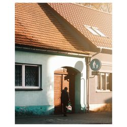 Rear view of woman walking on street