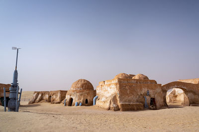 Ruins of historic building against clear sky