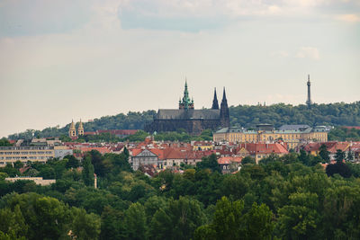 Buildings in town against sky