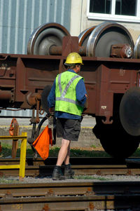 Full length of man standing by train