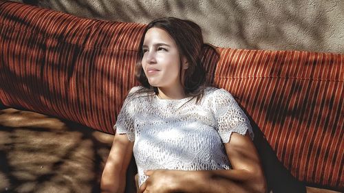 Portrait of young woman lying down
