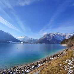 Scenic view of snowcapped mountains against sky