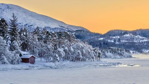 Scenic view of snow covered landscape against sky