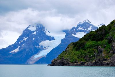 Scenic view of mountains against cloudy sky