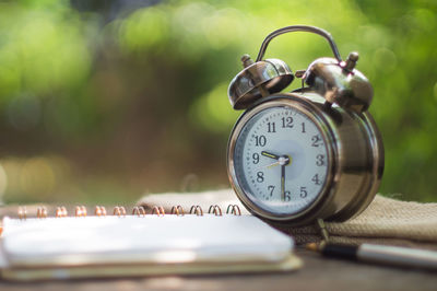 Close-up of clock on table