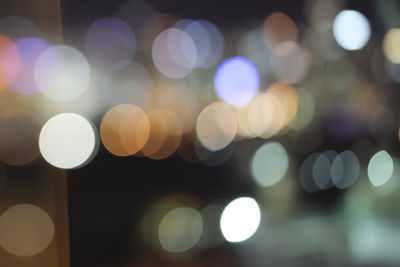 Defocused image of illuminated lights at night