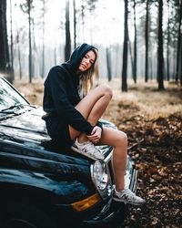 Woman sitting in a forest