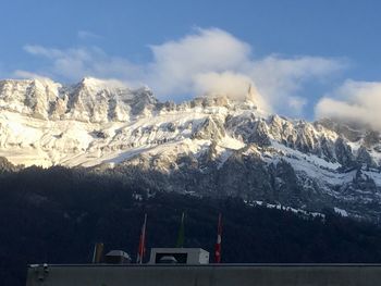 Scenic view of snowcapped mountains against sky