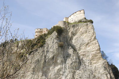 Low angle view of old building against sky