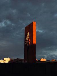 Low angle view of buildings against sky during sunset