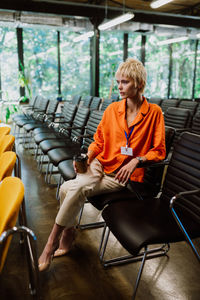 Young woman sitting on chair