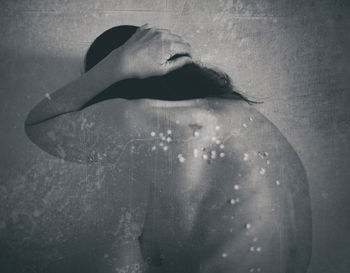 Rear view of woman swimming in water