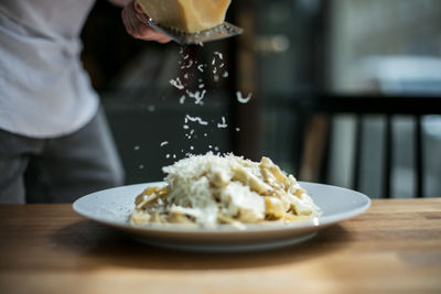 Close-up of man preparing food