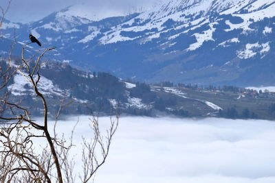 Scenic view of snowcapped mountains against sky