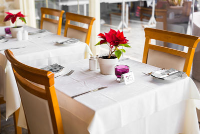 Flower vase on table in restaurant